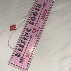 Kissing Booth pink and vintage sings.